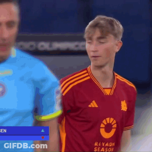 Man In Riyadh Season Jersey Standing Next To Another Man GIF