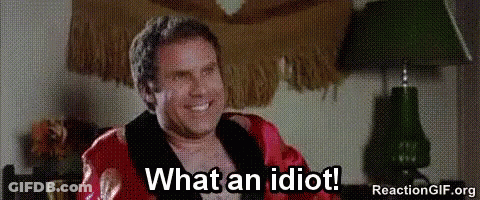Man In Robe Sitting In Chair Smiling GIF