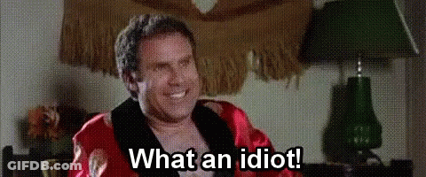 Man In Robe Sitting In Chair Smiling GIF