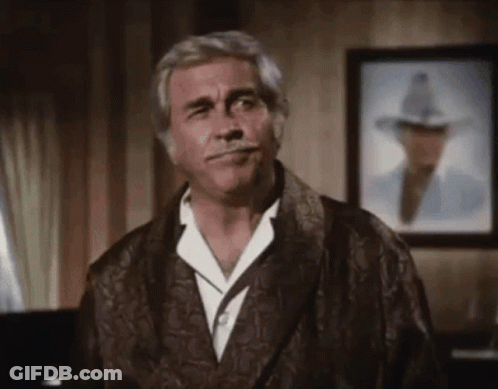 Man In Robe Standing Before Man In Hat GIF