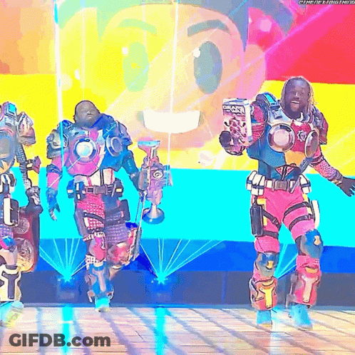 Man In Robot Costume Holding Trophy GIF