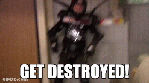 Man In Robot Costume Walking Down Hallway Saying Get Destroyed GIF
