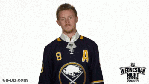 Man In Sabres Jersey In Front Of Wednesday Night Hockey Sign GIF