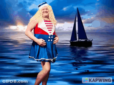 Man In Sailor Costume In Front Of Boat GIF