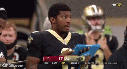 Man In Saints Jersey Holding Tablet GIF