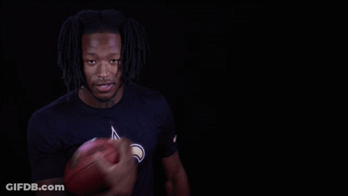 Man In Saints Shirt Holding Football GIF