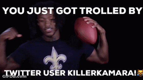 Man In Saints Shirt Holding Football Thumbs Up GIF