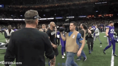 Man In Saints Shirt Walking On Field GIF