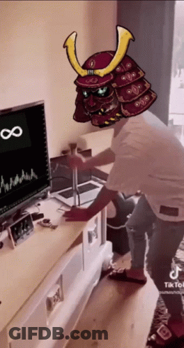 Man In Samurai Helmet In Front Of Computer Monitor GIF