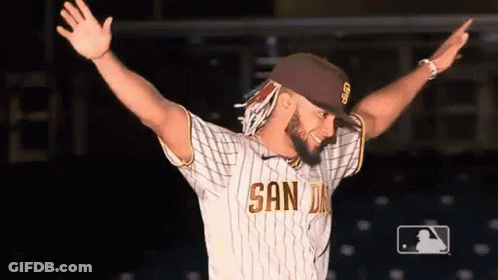 Man In San Diego Jersey Standing With Arms Out GIF