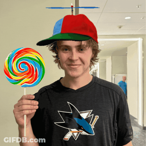 Man In San Jose Sharks Shirt Holding Lollipop GIF