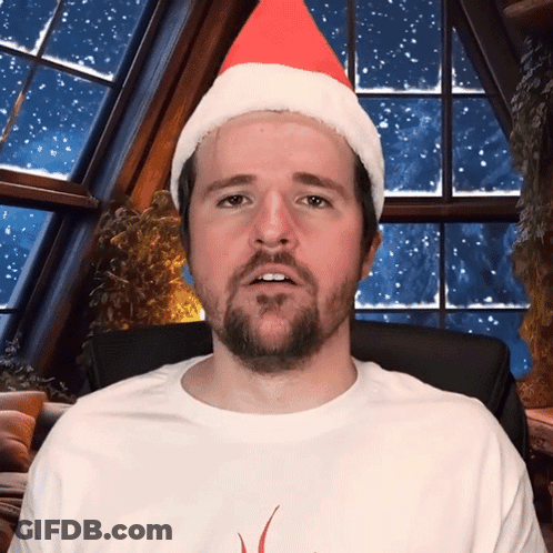 Man In Santa Hat And White Shirt GIF