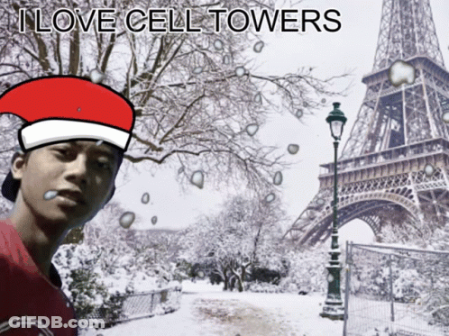 Man In Santa Hat At Snowy Eiffel Tower GIF