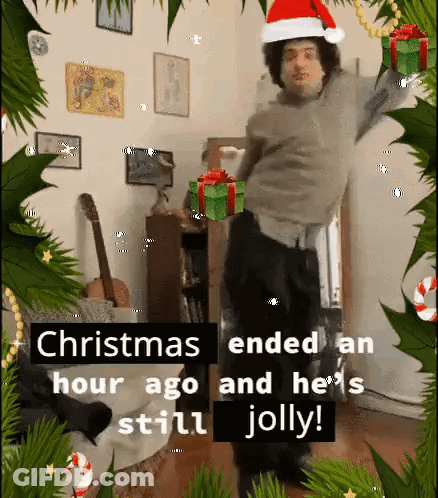 Man In Santa Hat Dancing At Christmas GIF