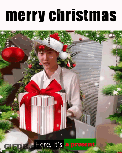 Man In Santa Hat Holding Gift GIF