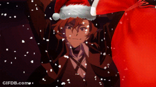 Man In Santa Hat Holding Red Bag In Snow GIF