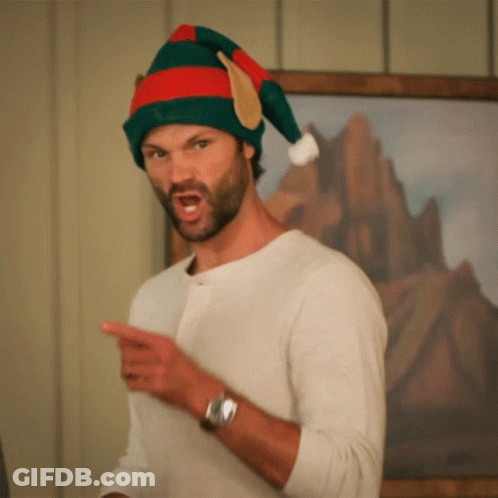 Man In Santa Hat Pointing GIF