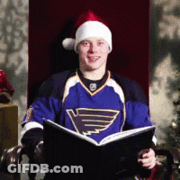 Man In Santa Hat Reading Book GIF