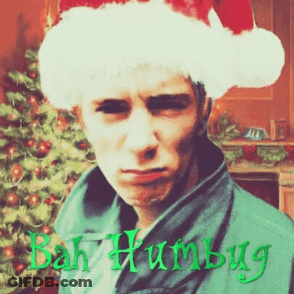 Man In Santa Hat Saying Bah Humbug GIF