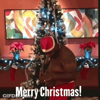 Man In Santa Hat Wishing Merry Christmas GIF