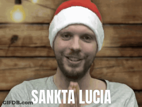 Man In Santa Hat With Sankta Lucia GIF