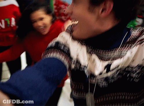 Man In Santa Sweater Dancing With Another Man GIF
