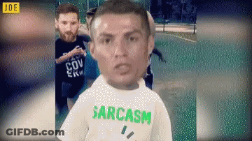 Man In Sarcasm T-Shirt Standing In Front Of Group GIF