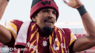 Man In Scarf And Beanie Holding Arms Up GIF