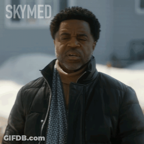 Man In Scarf And Jacket With Skymed GIF
