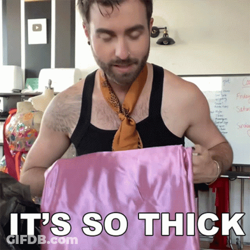 Man In Scarf Holding Pink Cloth Saying It's So Thick GIF