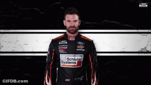 Man In Schluter Systems Jacket At Race Track GIF