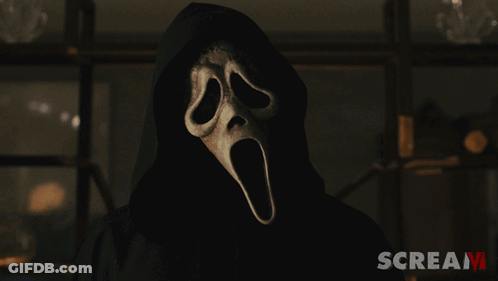 Man In Scream Costume With Have At Banner GIF