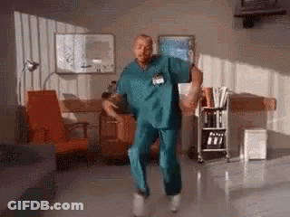 Man In Scrub Suit Dancing In Hospital Room GIF