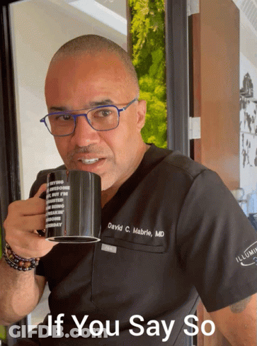 Man In Scrub Top Holding Mug GIF