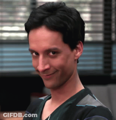 Man In Scrub Top Looking At Camera GIF
