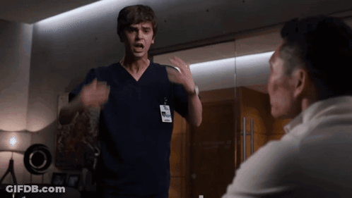 Man In Scrub Top With Name Tag Saying Dr GIF