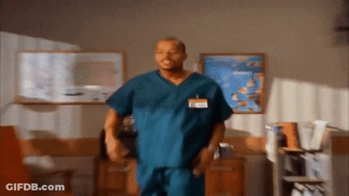 Man In Scrub With Name Tag Saying A GIF