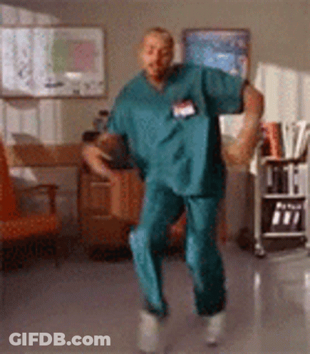 Man In Scrubs Dancing In Hospital GIF