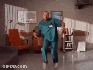 Man In Scrubs Dancing In Hospital Waiting Room GIF