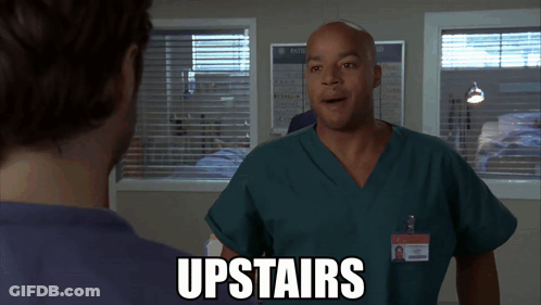 Man In Scrubs Talking With Upstairs Text GIF