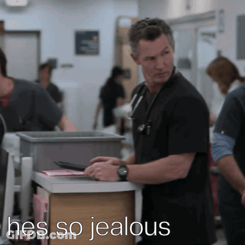 Man In Scrubs With Hes So Jealous Above Him GIF