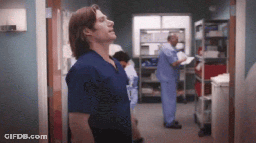 Man In Scrubs With Surgeon Name Tag GIF