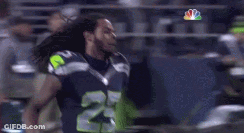 Man In Seahawks Jersey Standing On Field GIF