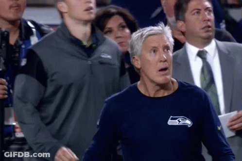Man In Seahawks Shirt Standing In Crowd GIF