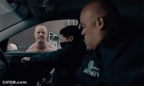 Man In Security Jacket In Car GIF