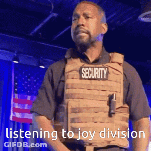 Man In Security Vest Listening To Joy Division GIF