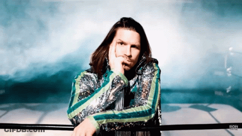 Man In Sequined Jacket Leaning On Railing With Roh GIF