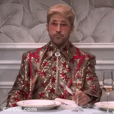 Man In Sequined Suit With Champagne And Plates GIF