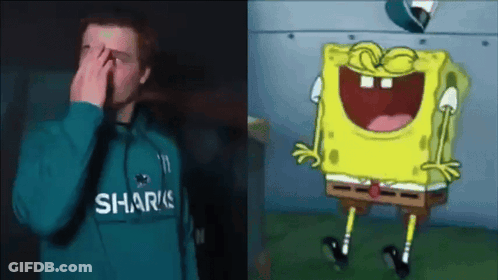 Man In Sharks Sweatshirt Covering Face Beside Laughing SpongeBob GIF