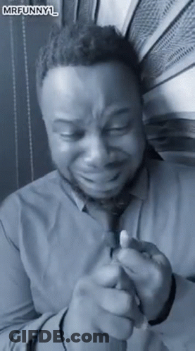 Man In Shirt And Tie Crying Holding Lighter GIF